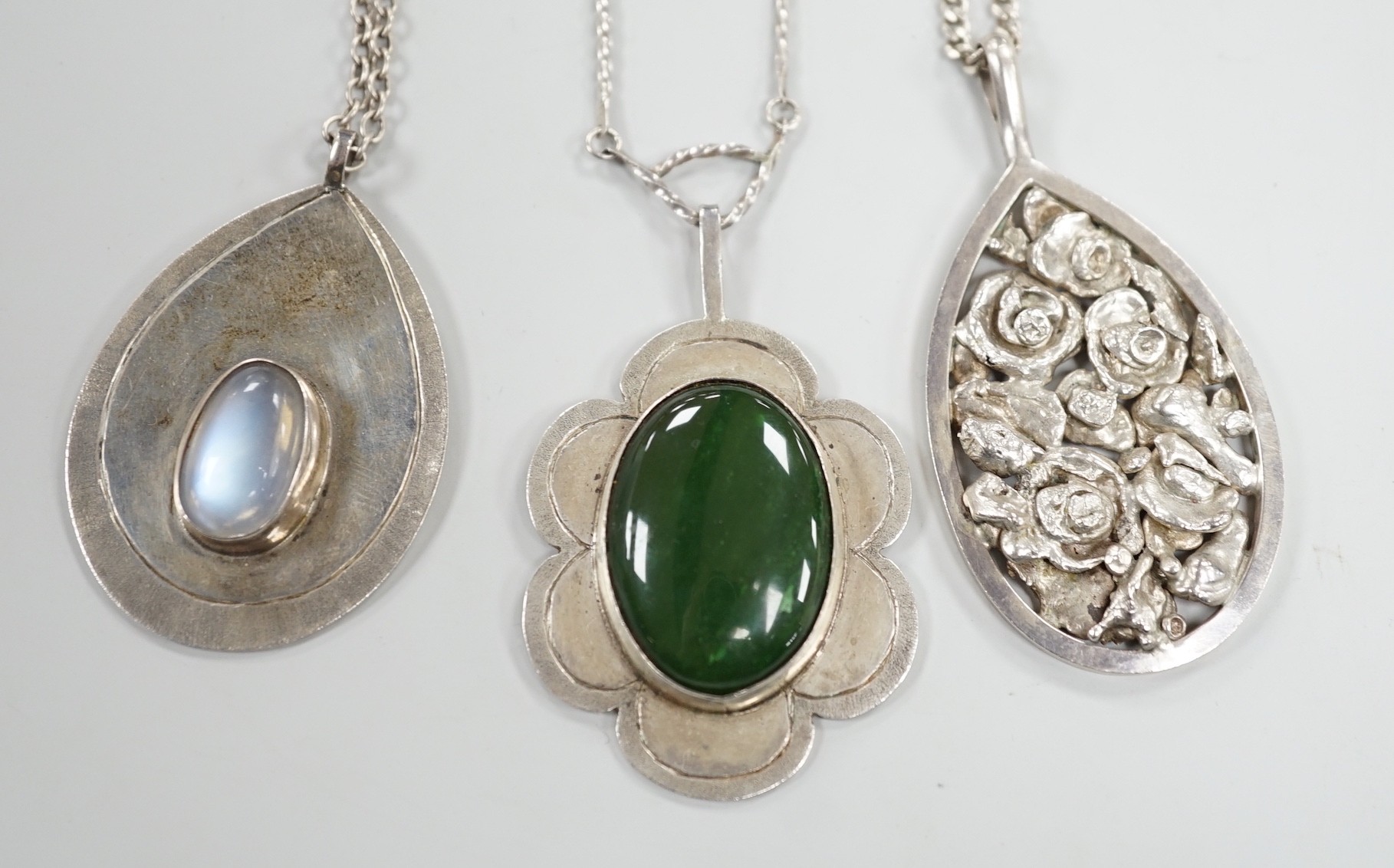 Three modern silver pendants by H.A. Crawshaw? including moonstone set pear shaped pendant, 53mm, all with chains.